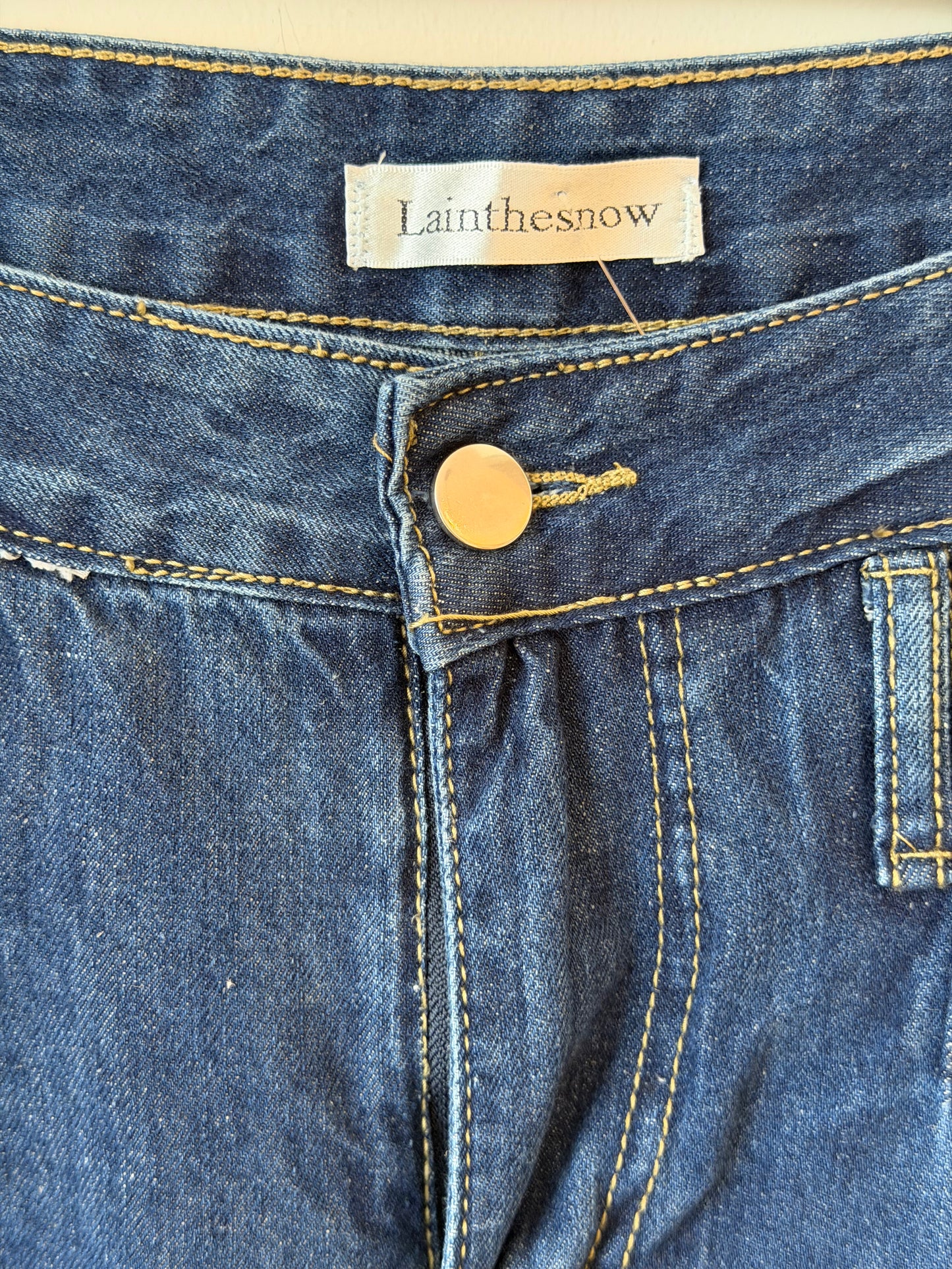 Wide-Leg Pleated Jeans